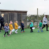 Nursery children at New City College walk and clap for Captain Sir Tom Moore