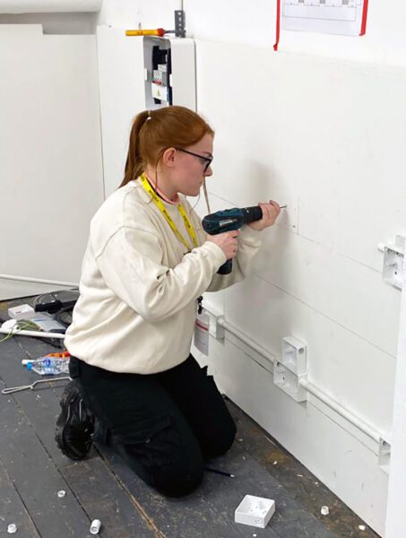 Female construction student Remi Newman is celebrating the double after winning a London-wide Electrician of the Year competition – and then being offered an apprenticeship by ESG